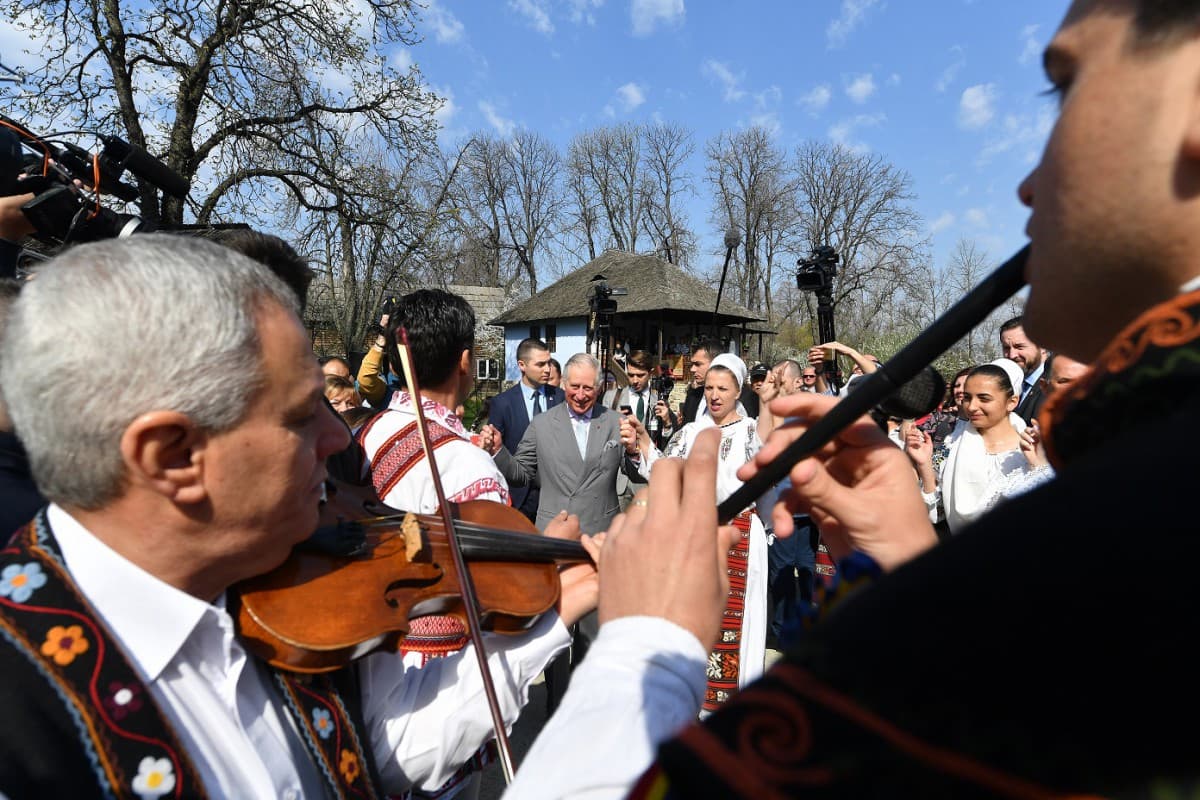 Prince Charles tries traditional Romanian dance during Bucharest Village Museum visit